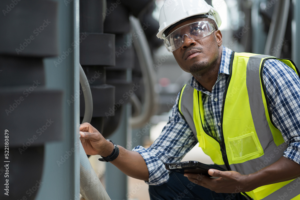 African American male plumber worker check or maintenance sewer pipes network system at construction site African American male plumber worker check or maintenance sewer pipes network system at construction site