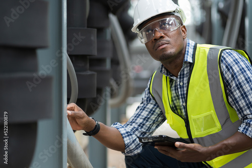 Fototapeta African American male plumber worker check or maintenance sewer pipes network sy