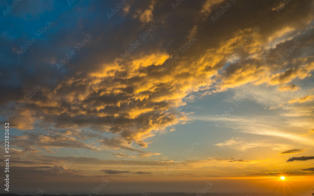 Beautiful cloudy sky during and before golden hour and sunset. Beautiful cloudy sky during and before golden hour and sunset.