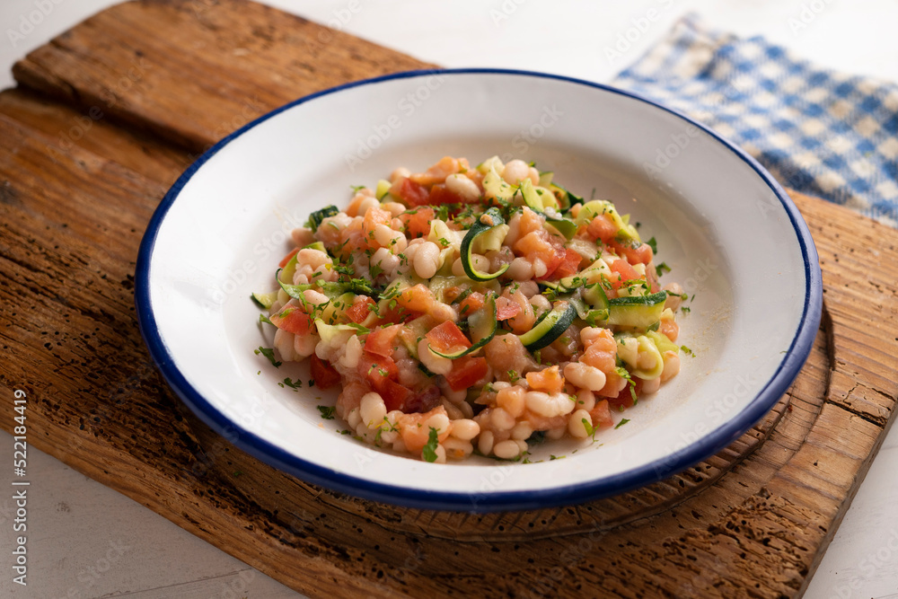 Broad bean salad with zucchini, salmon and tomato.