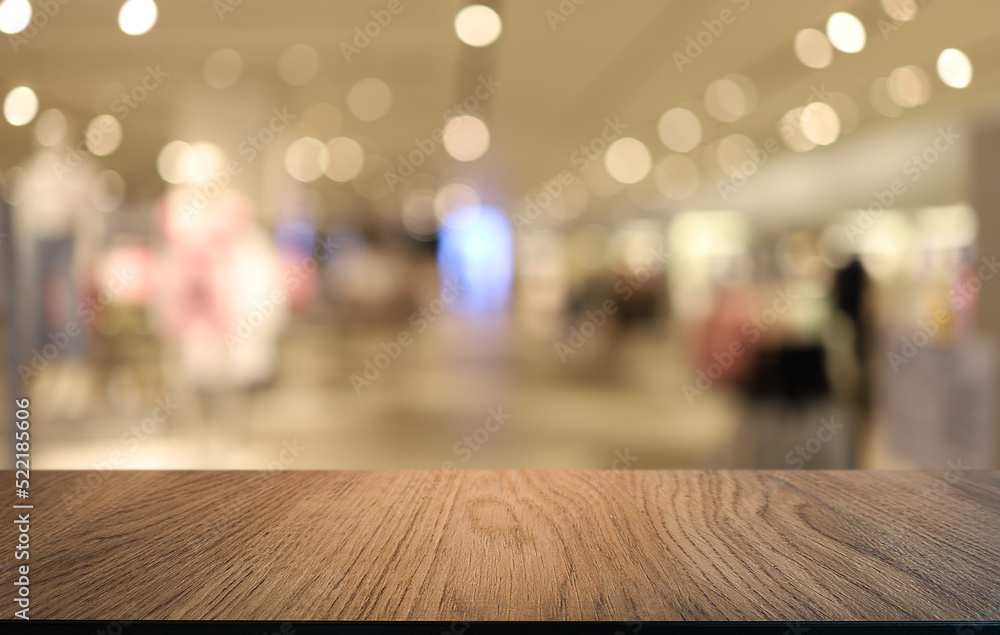 Empty wooden table in front of abstract blurred background of coffee shop . can be used for display or montage your products.Mock up for display of product Empty wooden table in front of abstract blurred background of coffee shop . can be used for display or montage your products.Mock up for display of product
