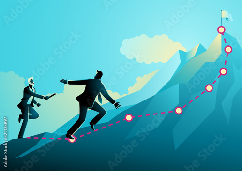 Older businessman passing the baton to younger businessman to continue running up the mountain photo