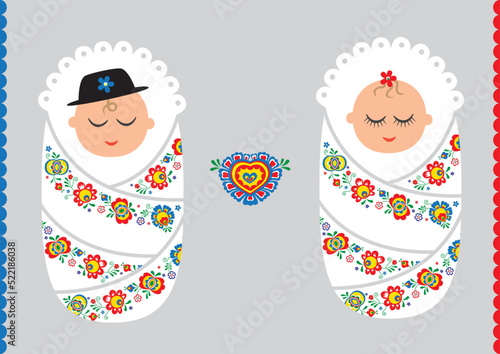 Babies in a swaddler with moravian folklore design