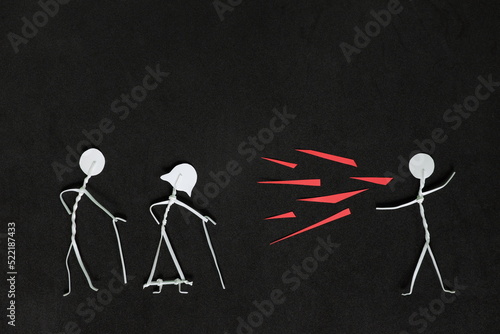 Seniors or old people verbal and emotional abuse concept. Stick man figure shouting or yelling on elderly couple stick figure in dark black background creative composition. photo