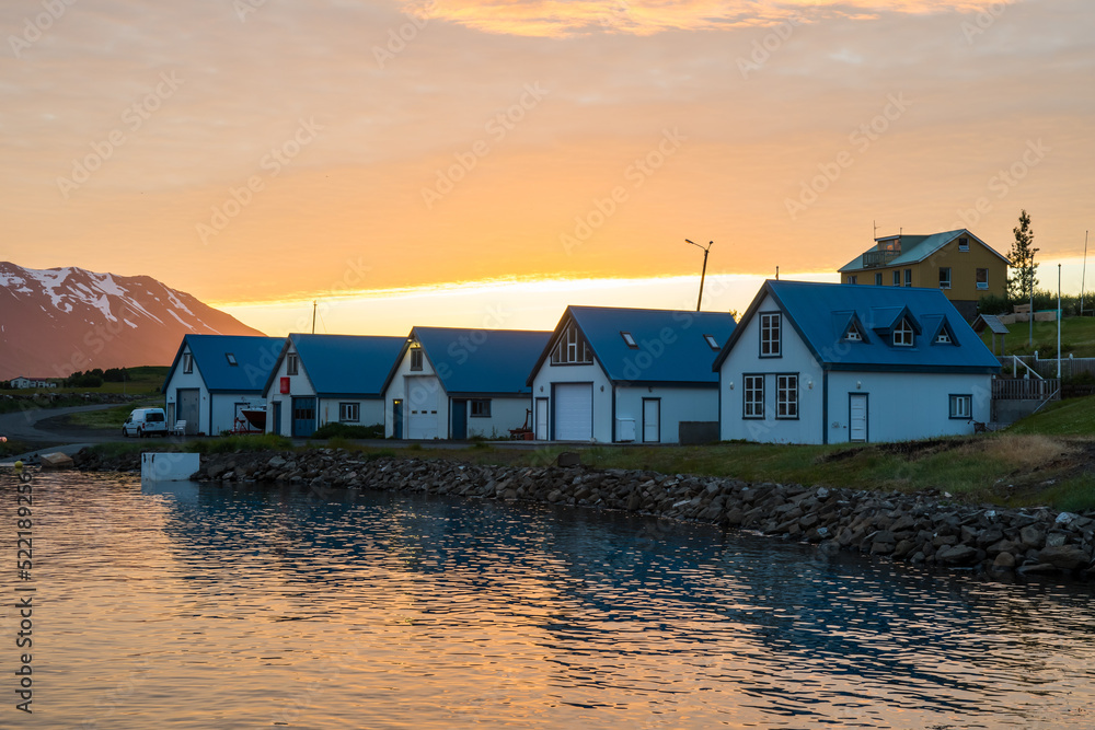 Summer sunset in the village on island of Hrisey in Iceland Summer sunset in the village on island of Hrisey in Iceland