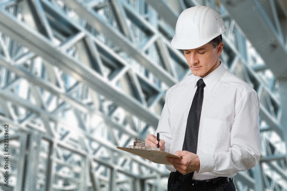 Engineer under checking the industry cooling tower air conditioner of large industrial building to control air system. Engineer under checking the industry cooling tower air conditioner of large industrial building to control air system.