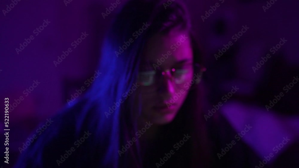 Attractive young woman working in home at night. Attractive young woman working in home at night.