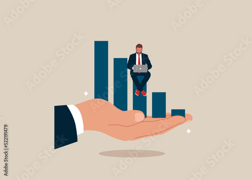 Businessman working with computer on growth graph in giant hand. Business support or improvement, growing career, investment growth, income.