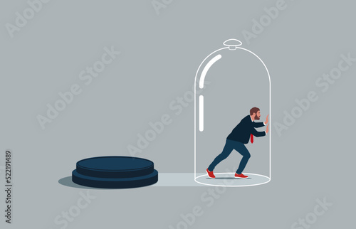 Businessman inside the glass try to push so hard to break boundary. Business constraints or stagnant, prohibition or difficulty prevent from improvement or success. photo