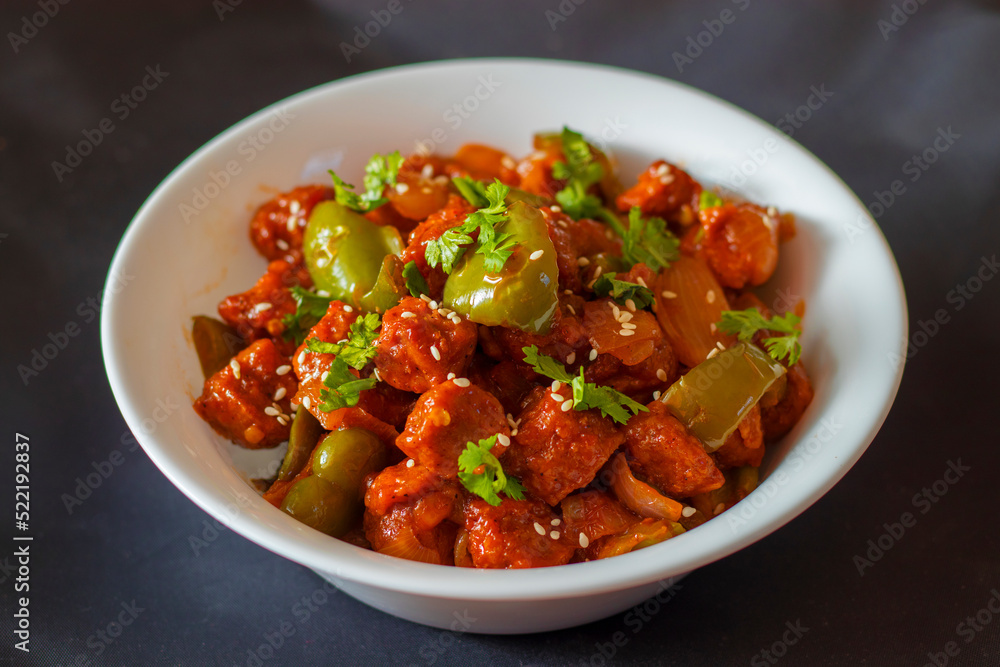 selective focus of Soya Manchurian/Chili Soya bean chunks recipe. with a decorative background. selective focus of Soya Manchurian/Chili Soya bean chunks recipe. with a decorative background.