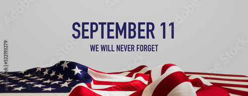 United States Flag Banner with Patriot Day Caption on White. Authentic September 11 Background. photo