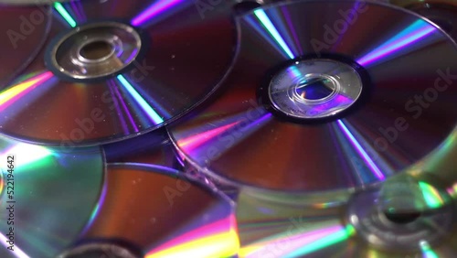 close-up of a many compact discs and other dvds falling dawn
