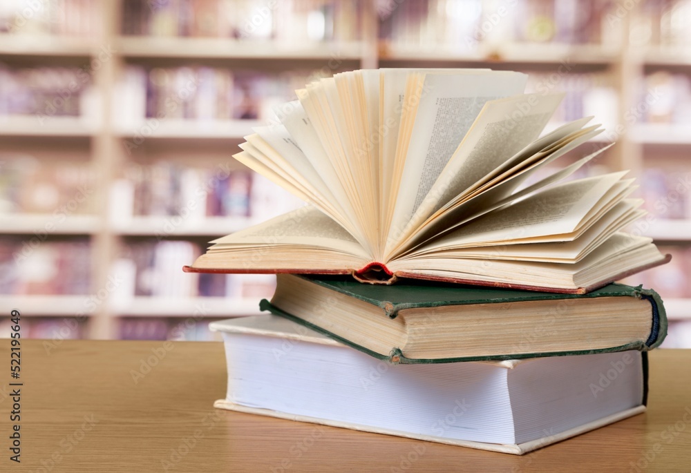 A simple composition of many books, stack or pile of books on wooden table concept A simple composition of many books, stack or pile of books on wooden table concept