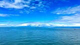 the view from the deck of the covering ship to the sea or ocean is visible Horizon clear blue color of water and sky can be used as a background For title text or advertising calm rest and relaxation