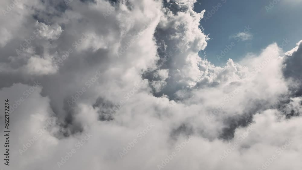Aerial view Flying through beautiful thick fluffy clouds. Amazing timelapse of flowing soft white clouds moving slowly across a clear blue sky in clear daylight. Aerial view Flying through beautiful thick fluffy clouds. Amazing timelapse of flowing soft white clouds moving slowly across a clear blue sky in clear daylight.