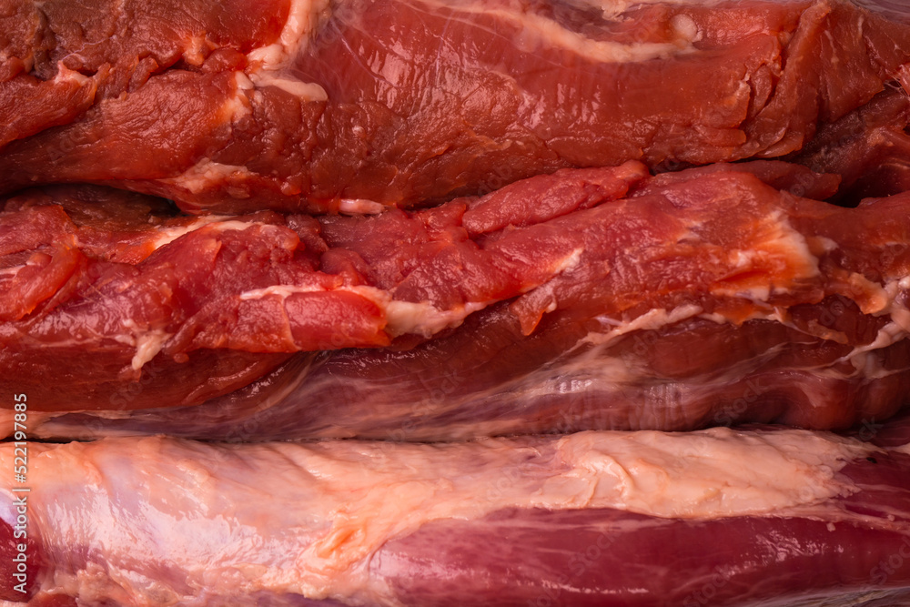 Raw pork tenderloin isolated on a white background. Raw pork tenderloin isolated on a white background.