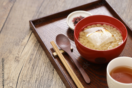 white adzuki Zenzai ( sweet beans soup with baked rice cake), a Japanese dessert photo