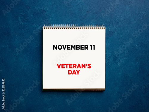 The reminder November eleven veterans day written on a notebook.