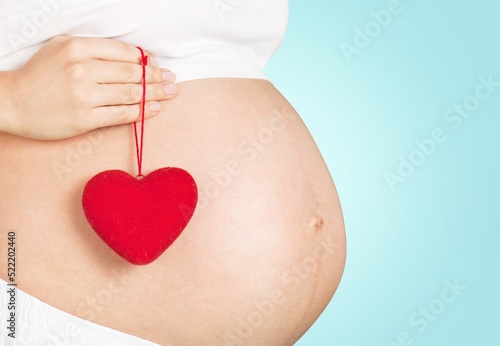 Wallpaper Mural Young healthy woman hand made heart shape on her stomach. Concept of good digestive, healthy gut, probiotics, slim fit, gynecology and woman health care. Torontodigital.ca