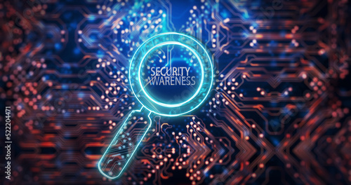 Image of magnifying glass with security awareness text over computer circuit board
