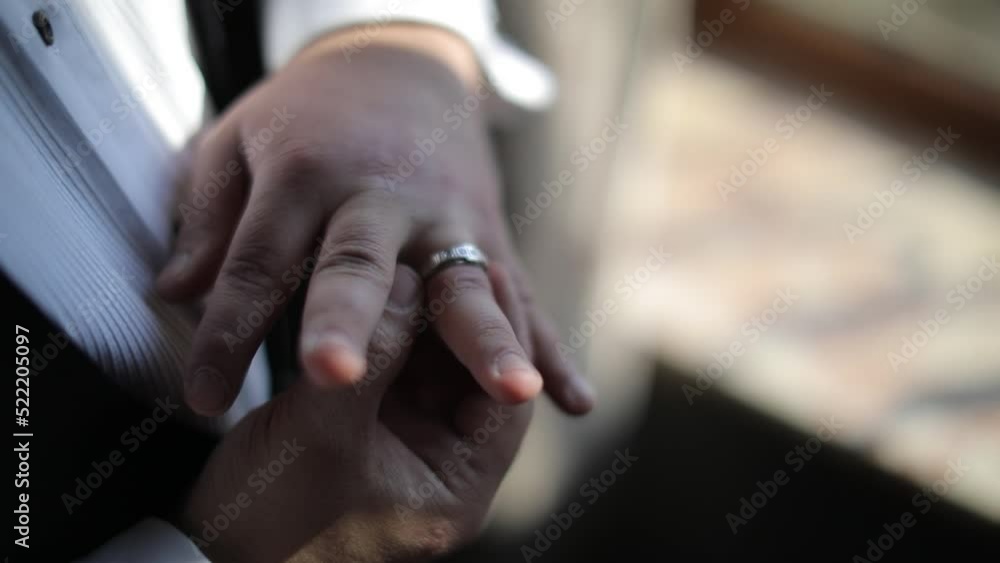 Love story, the groom puts the wedding ring on his finger. Love story, the groom puts the wedding ring on his finger.