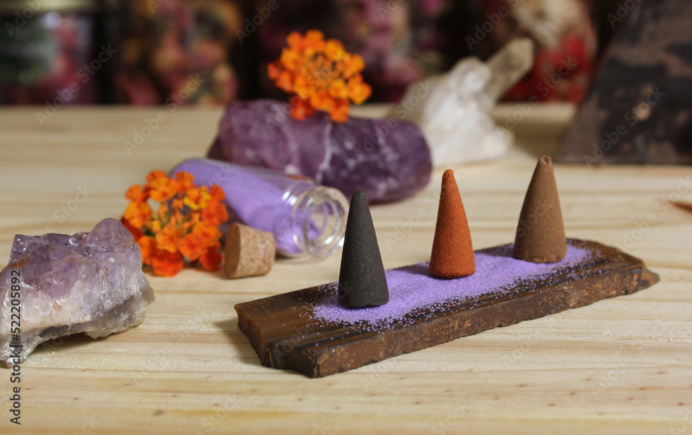 Incense Cones on Stone Slab With Crystals and Flowers