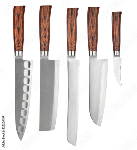 Set of five kitchen knives of Japanese design, with identical wooden handles and blades of different lengths and configurations, arranged vertically and isolated on a white background. photo