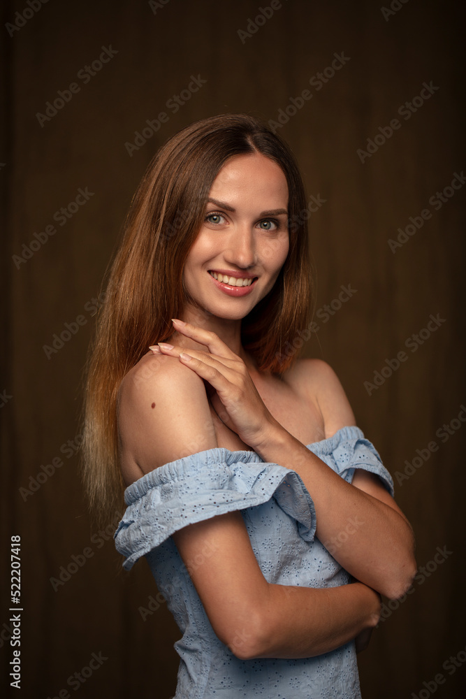 Fototapeta premium studio portrait on a dark background of a beautiful young woman