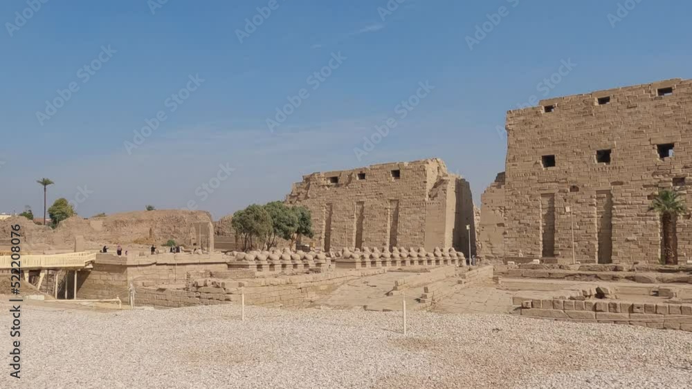 Tourists visiting the Luxor Karnak Temple in Egypt. Establishing panning shot Tourists visiting the Luxor Karnak Temple in Egypt. Establishing panning shot