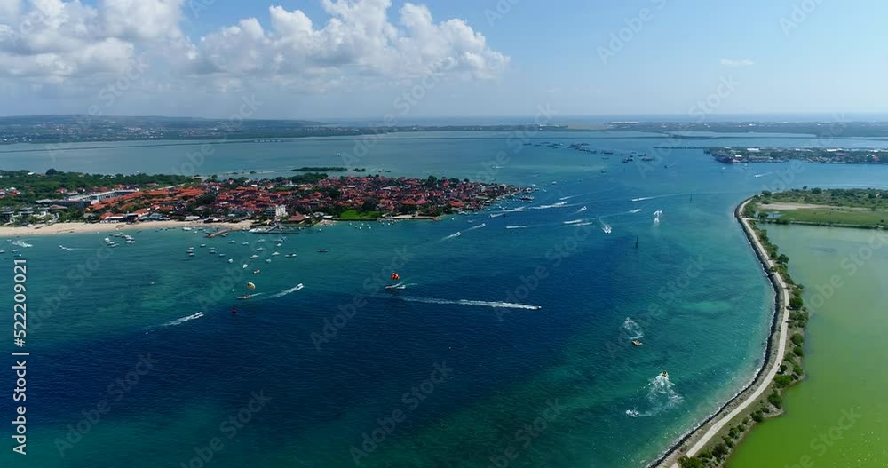 Aerial shot of boats doing watersports activities over turquoise water Aerial shot of boats doing watersports activities over turquoise water