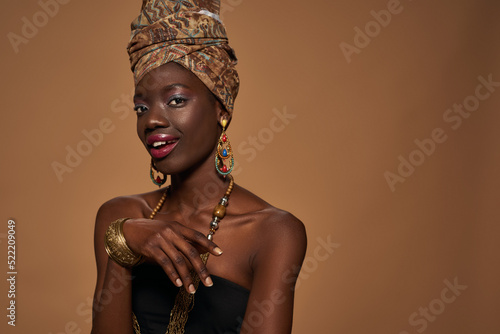 Smiling girl wear african outfit and accessories