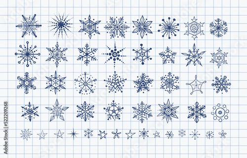 Collection of hand drawn blue pen sketch doodle snowflakes on lined paper background. Vector doodle sketch illustration.