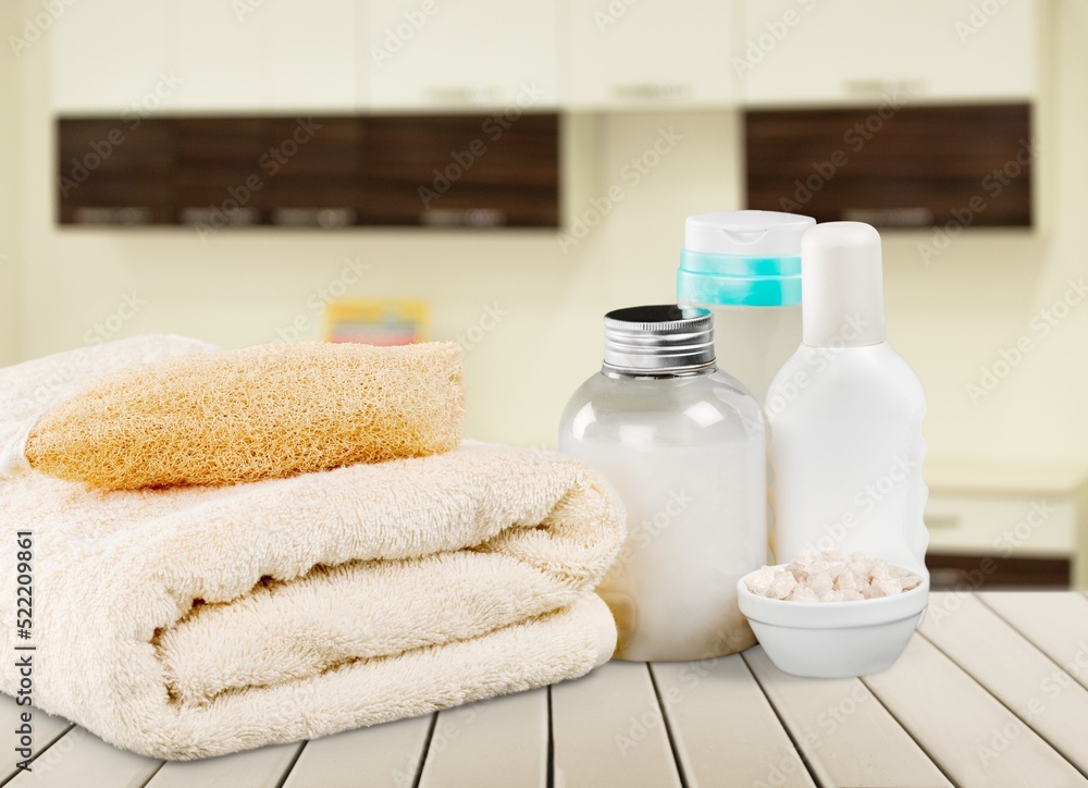 Fresh clean towels on wooden table in bathroom. Fresh clean towels on wooden table in bathroom.