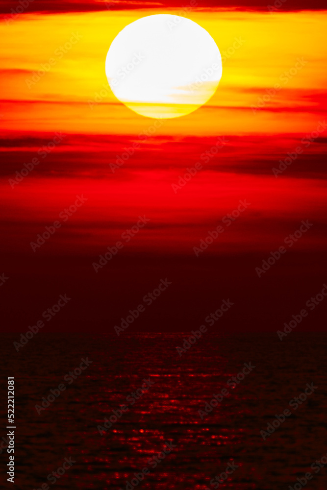 Tropical sunset sunrise over the ocean sea horizon.