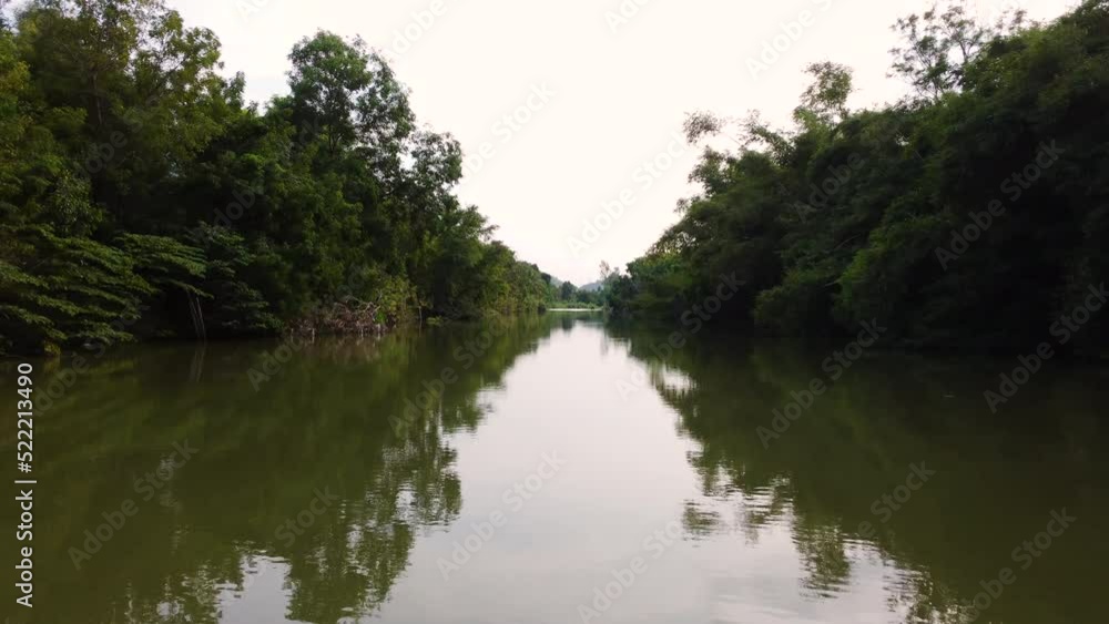 drone fly above the river with flat stream of water inside the Vietnamese jungle drone fly above the river with flat stream of water inside the Vietnamese jungle