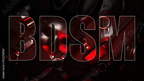 Foto BDSM inscription on background of sex toys for erotic role-playing games with submission and domination
