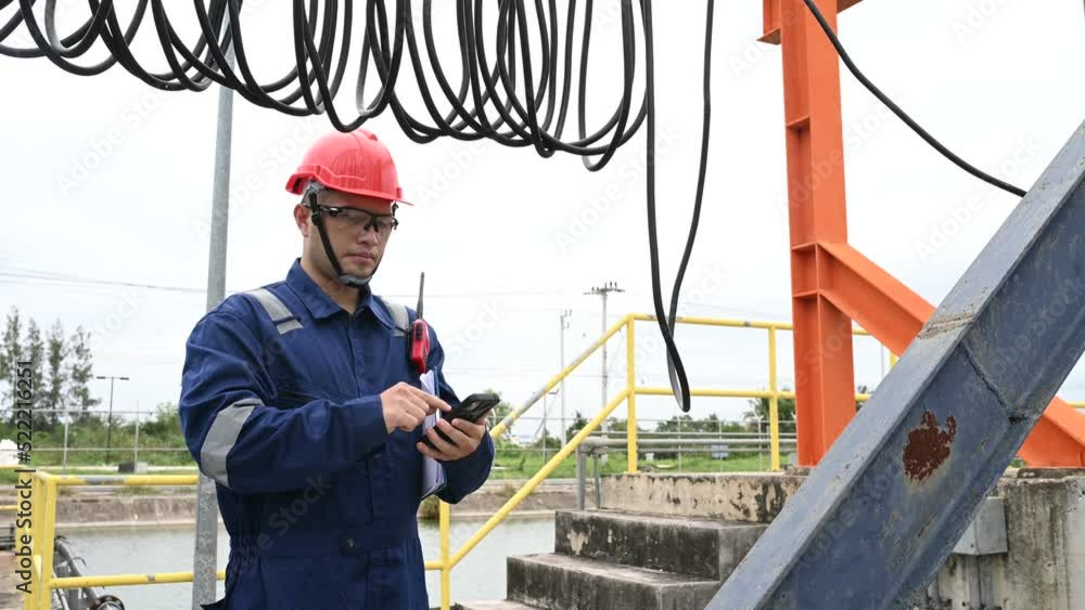 Water plant maintenance technicians, mechanical engineers check the control system at the water treatment plant. Water plant maintenance technicians, mechanical engineers check the control system at the water treatment plant.