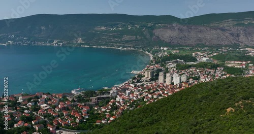 Aerial view overlooking the Herceg Novi city, in sunny Montenegro - circling, drone shot photo