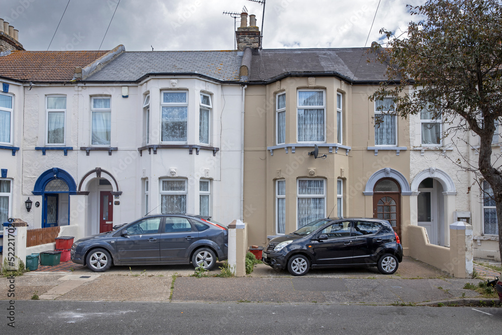 Papier peint photo avec Essex. England. UK, Great Brittain. Common British houses and two parked cars in front yard. #522217029