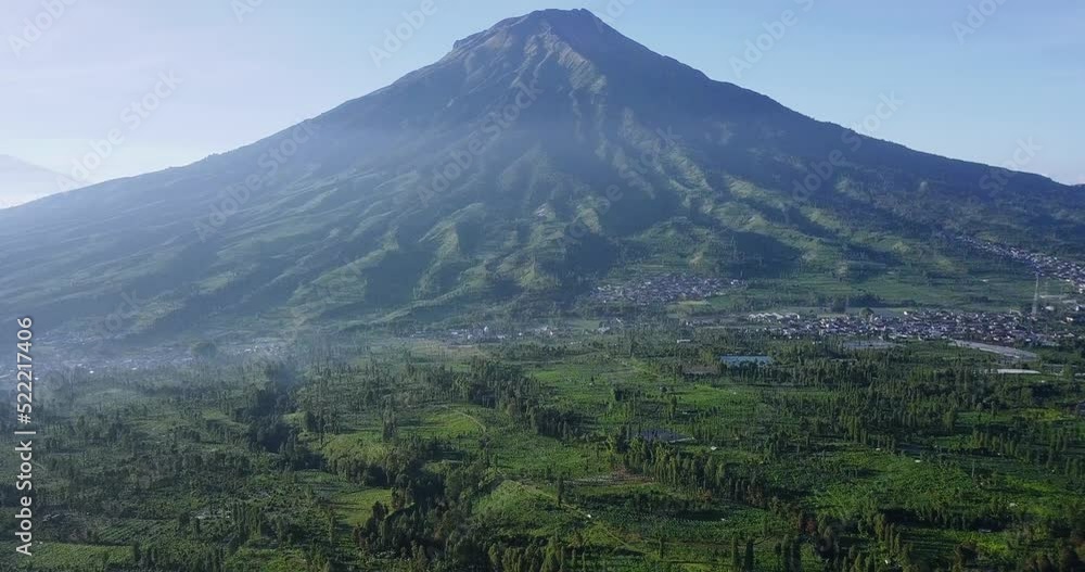 tobbaco plantation with mount Sumbing on the background in the morning. Indonesia's cigarette industry. fields and majestic mountains. tobbaco plantation with mount Sumbing on the background in the morning. Indonesia's cigarette industry. fields and majestic mountains.