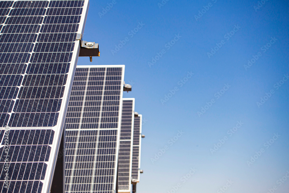 Autonomous solar energy station close-up in the desert mountains against the blue sky Autonomous solar energy station close-up in the desert mountains against the blue sky