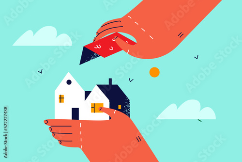 Person put roof to house model 
