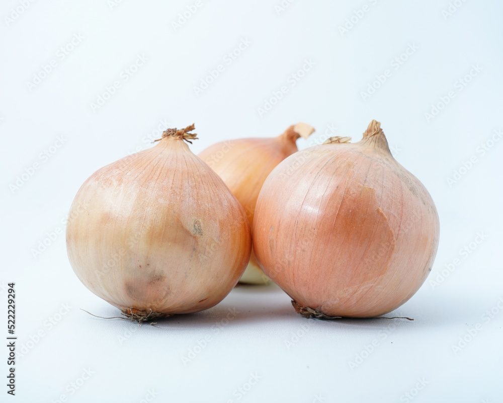 Fototapeta premium Three Onions isolated on white background