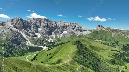 Wallpaper Mural Amazing view on Dolomites peak with a hiking path leading to the mountains. Sunrise drone shot of idyllic Alpe di Suisi mountains in South Tyrol. Wooden cottages at sunrise. Torontodigital.ca