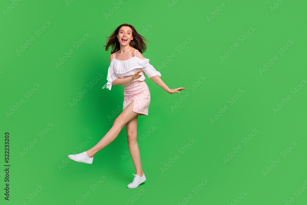 Full size photo of overjoyed positive girl have fun dance clubbing isolated on green color background Full size photo of overjoyed positive girl have fun dance clubbing isolated on green color background