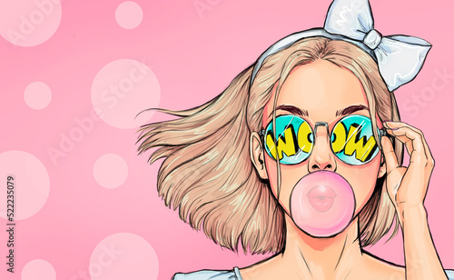 Fashionable girl with a stylish haircut inflates a chewing gum has amazed expression. Pop Art wow woman in glasses  photo