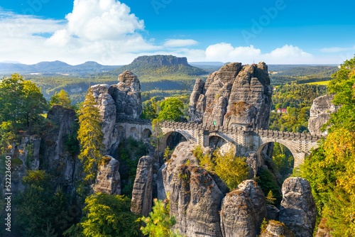 Panorama view of the Bastei. The Bastei is a famous rock formation in Saxon Switzerland National Park, near Dresden, Germany photo
