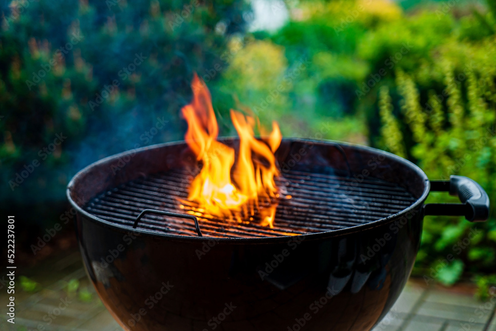 Grill with smoke over summer outdoor nature in garden or park Grill with smoke over summer outdoor nature in garden or park