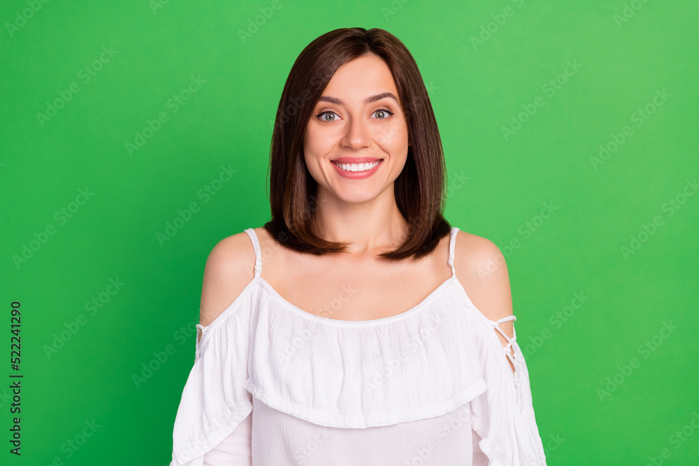 Photo portrait of lovely gentle elegant young woman look camera toothy smiling wear stylish white look isolated on green color background Photo portrait of lovely gentle elegant young woman look camera toothy smiling wear stylish white look isolated on green color background