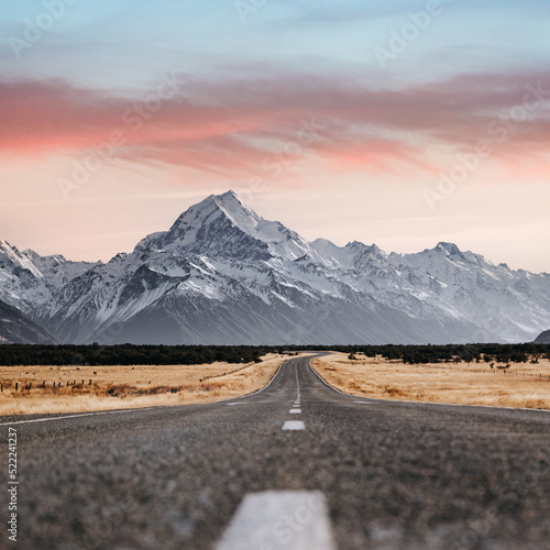 View of the majestic Aoraki Mount Cook with the road leading to Mount Cook Village. Taken during winter in New Zealand.
